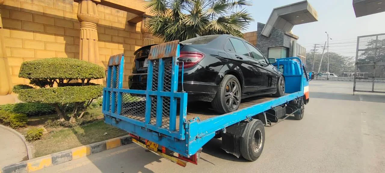 Car towing service assisting a broken-down vehicle safely